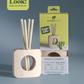 Rainwater & Bamboo Scent Stix + Stand Starter Kit in and out of packaging