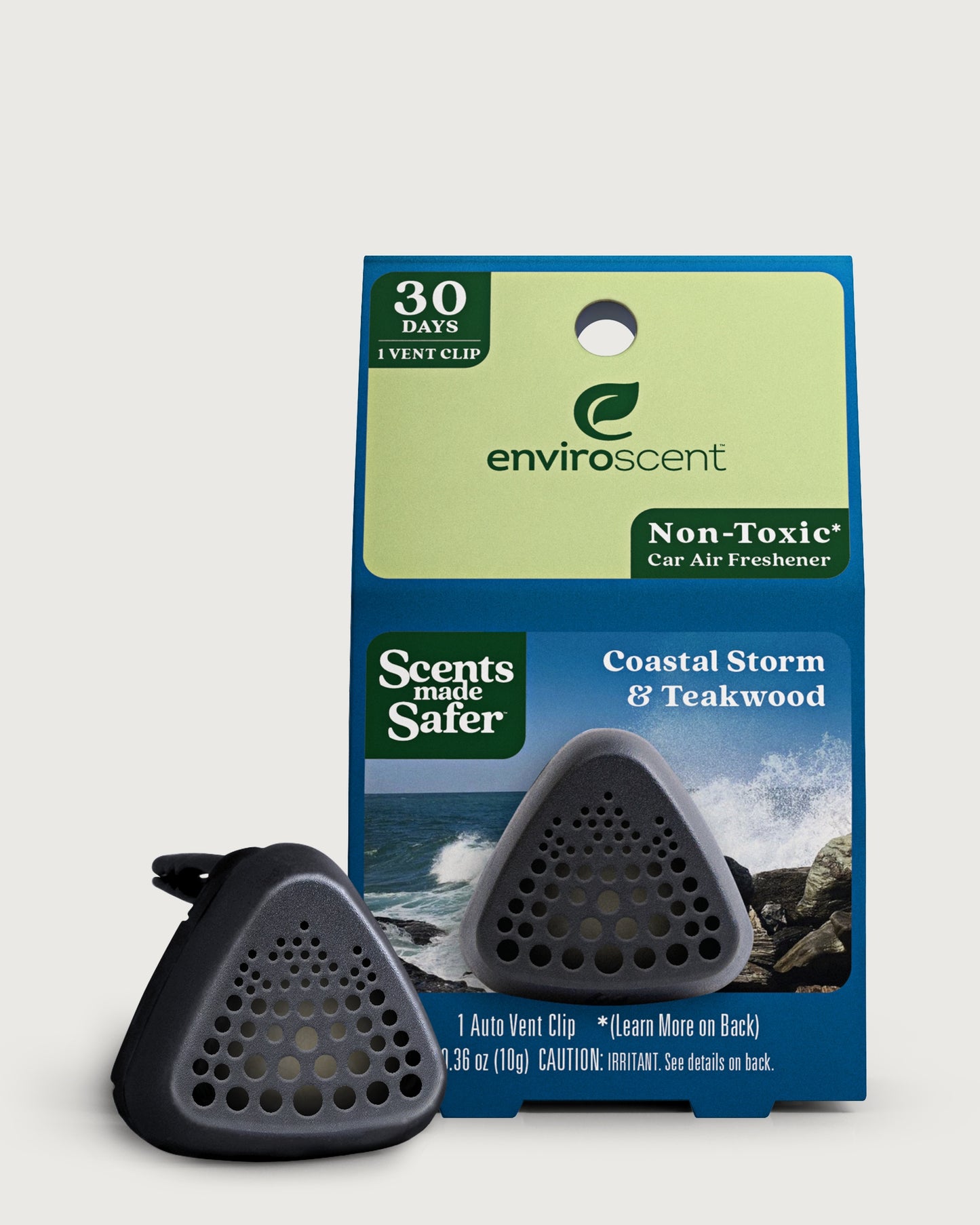 Enviroscent car air freshener vent clip shown in front of their retail packaging, Coastal Storm & Teakwood scent.
